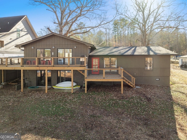 back of property featuring a deck