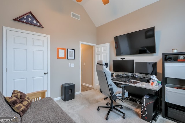 carpeted office space featuring ceiling fan and lofted ceiling