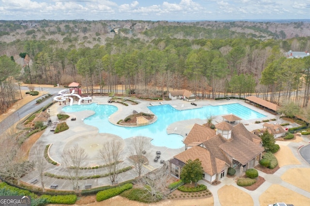 view of pool featuring a water slide