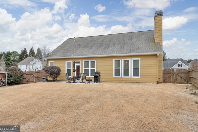 back of house featuring a patio area