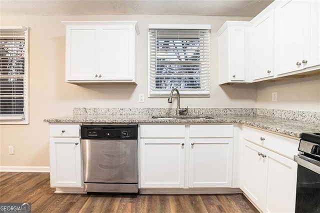 kitchen featuring sink, appliances with stainless steel finishes, dark hardwood / wood-style floors, light stone countertops, and white cabinets