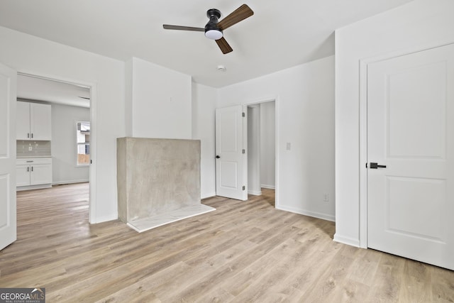 unfurnished room featuring ceiling fan and light hardwood / wood-style floors