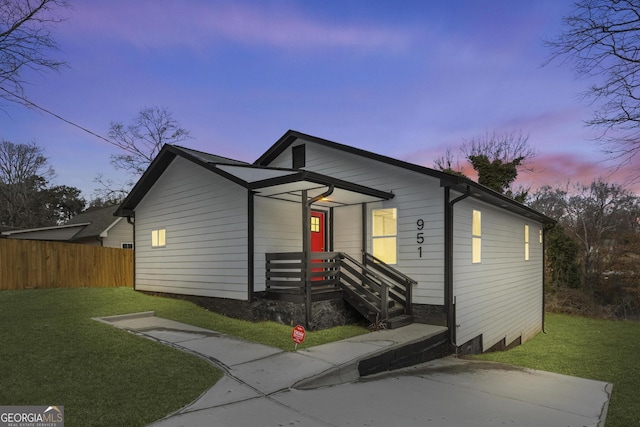 view of front of house with a yard