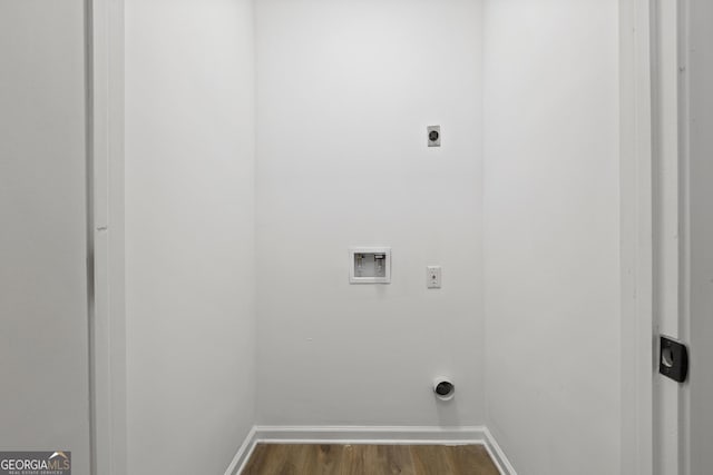 laundry room featuring electric dryer hookup, dark wood-type flooring, and washer hookup