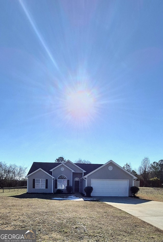 ranch-style home featuring a garage