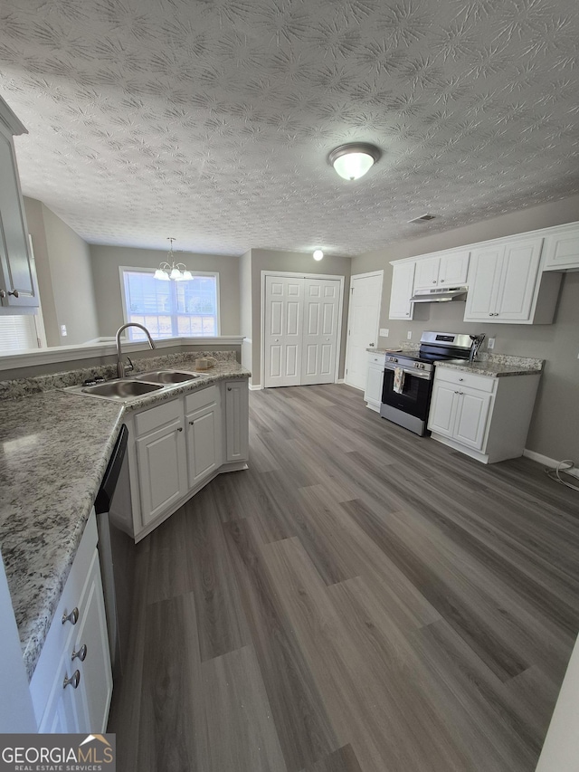 kitchen with sink, white cabinetry, a textured ceiling, appliances with stainless steel finishes, and dark hardwood / wood-style floors