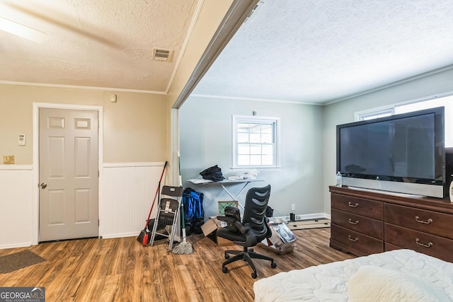 office space with ornamental molding, dark hardwood / wood-style floors, and a textured ceiling