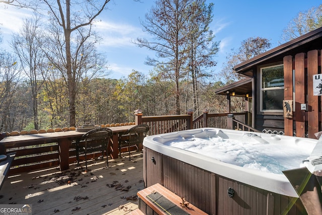 wooden terrace with a hot tub