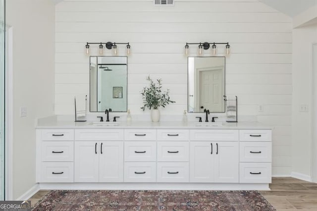 bathroom featuring hardwood / wood-style flooring and vanity