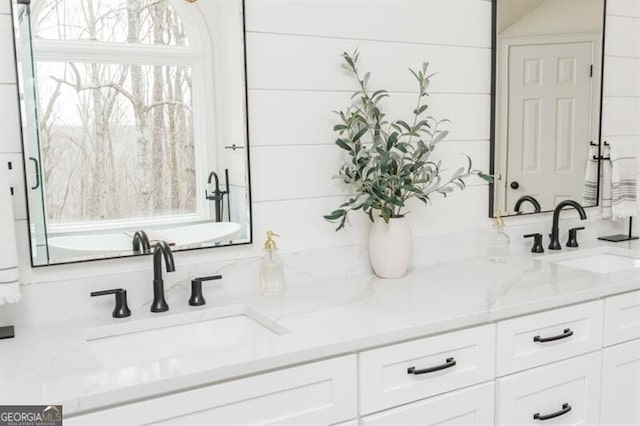 bathroom with vanity and plenty of natural light