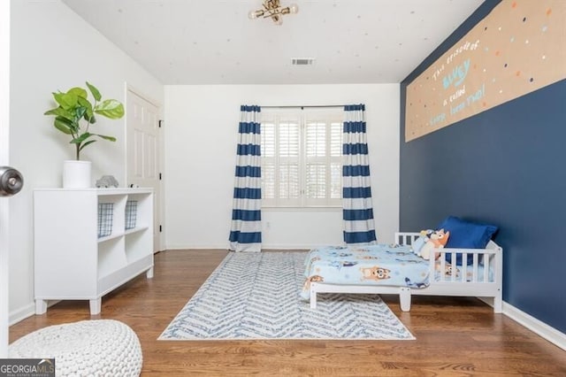 bedroom featuring hardwood / wood-style floors