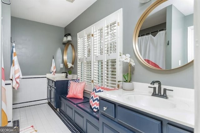 bathroom with tile patterned floors and vanity