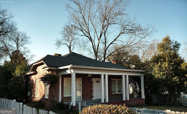 view of side of home featuring a porch