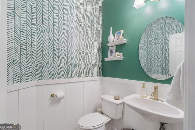 bathroom with sink and toilet