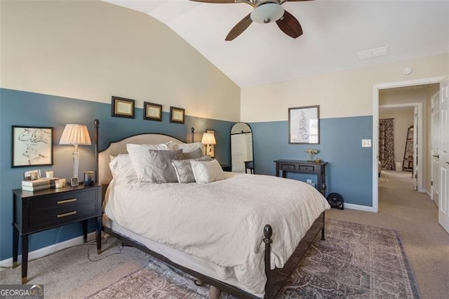 bedroom with vaulted ceiling, ceiling fan, and dark colored carpet