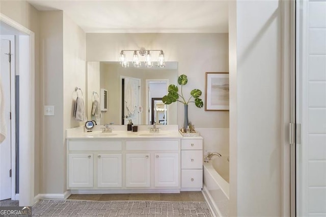 bathroom with a tub to relax in and vanity