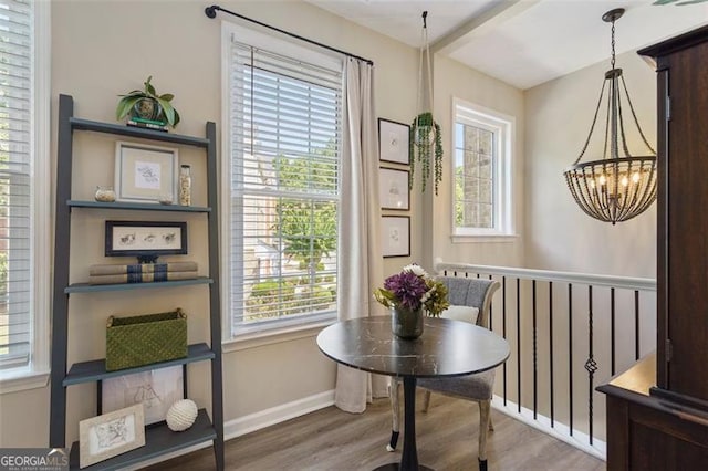 interior space with an inviting chandelier and hardwood / wood-style flooring