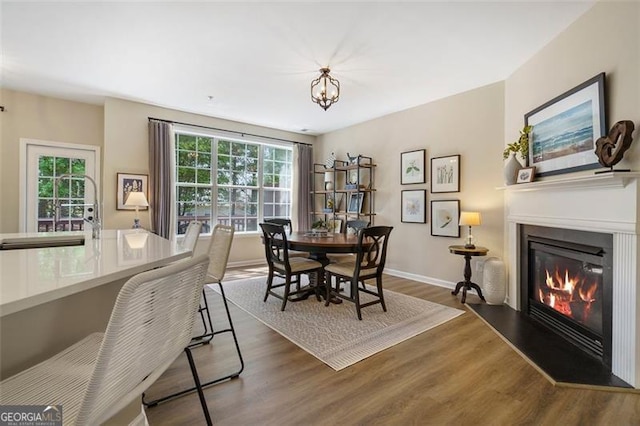 dining space with dark hardwood / wood-style flooring