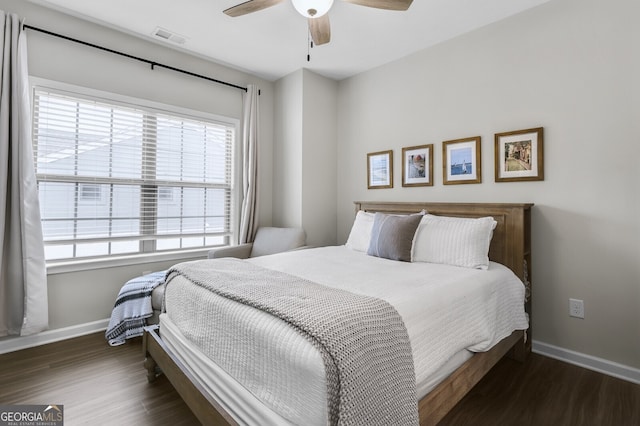 bedroom featuring dark wood-type flooring and ceiling fan