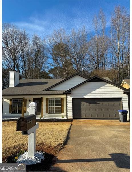 single story home featuring a garage