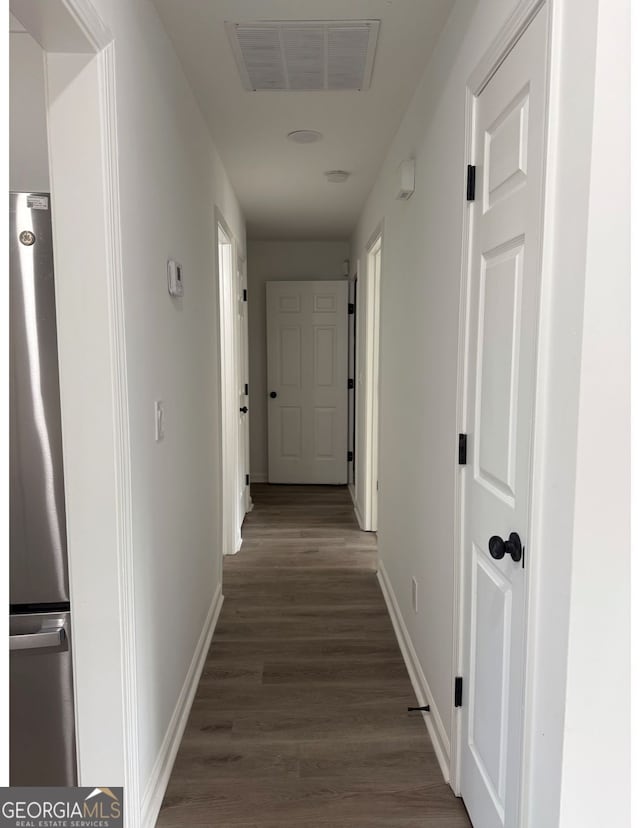 hall featuring dark wood-type flooring