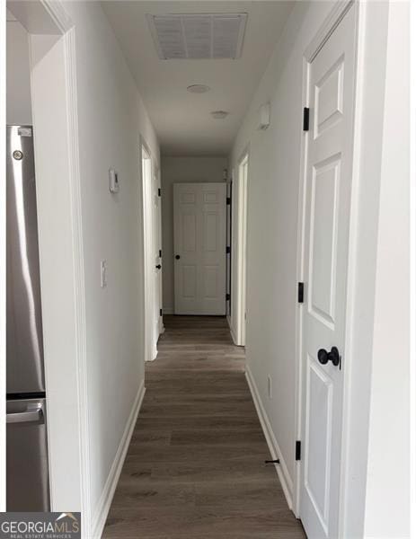 hallway featuring dark wood-type flooring