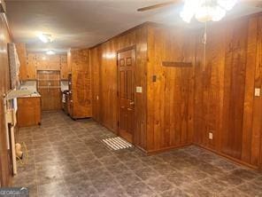 interior space featuring wooden walls