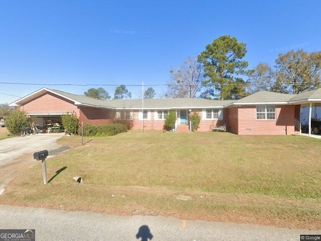 single story home with a garage and a front yard