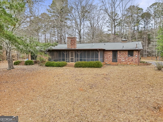 back of house with a sunroom