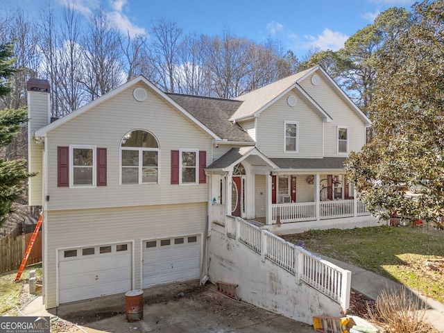 view of front of house featuring a porch and a garage