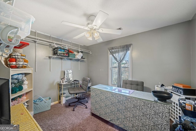 office space with carpet floors and ceiling fan