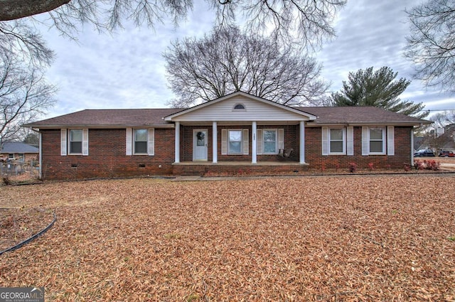 single story home featuring covered porch