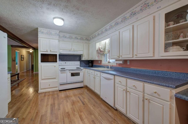 kitchen with white cabinets, sink, a textured ceiling, and white appliances