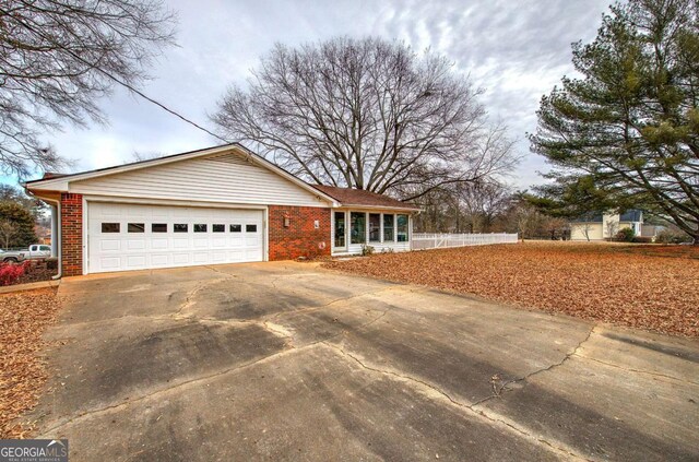 ranch-style home featuring a garage