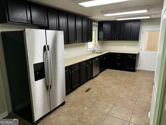 kitchen with appliances with stainless steel finishes and sink