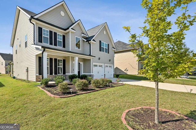 view of front facade with a garage, a front yard, and covered porch