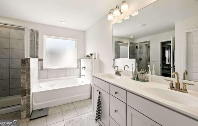 bathroom with tile patterned floors, shower with separate bathtub, and vanity