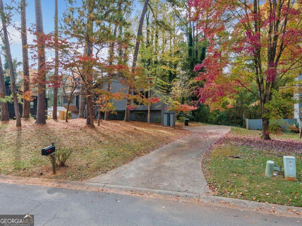 view of property hidden behind natural elements