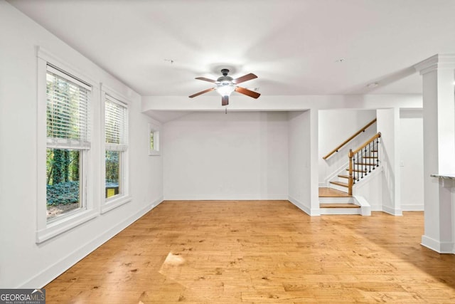 spare room featuring light hardwood / wood-style flooring and ceiling fan