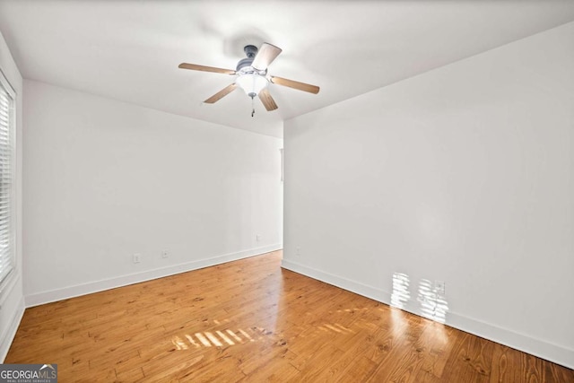 unfurnished room featuring ceiling fan and light hardwood / wood-style floors