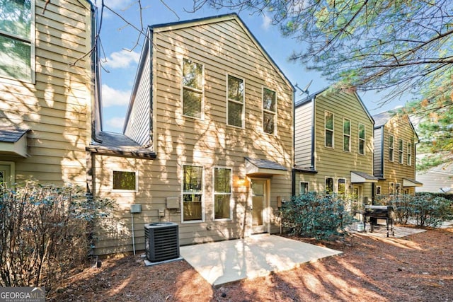 exterior space featuring cooling unit and a patio