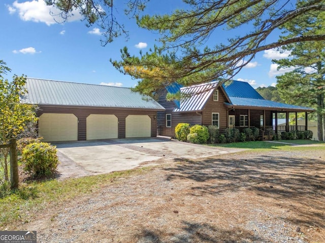 view of front facade featuring a porch and a garage