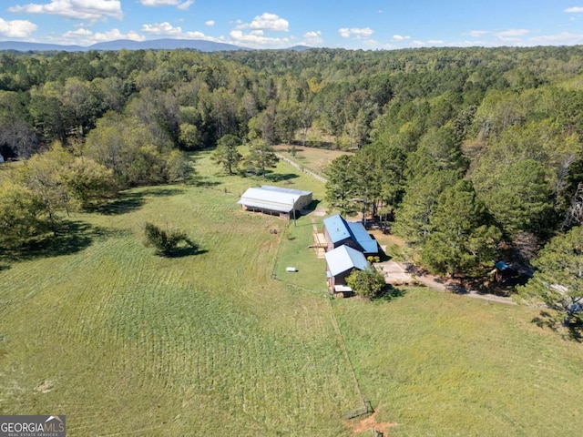 birds eye view of property featuring a rural view