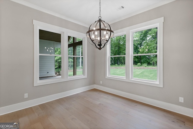 unfurnished dining area featuring plenty of natural light and light wood-type flooring