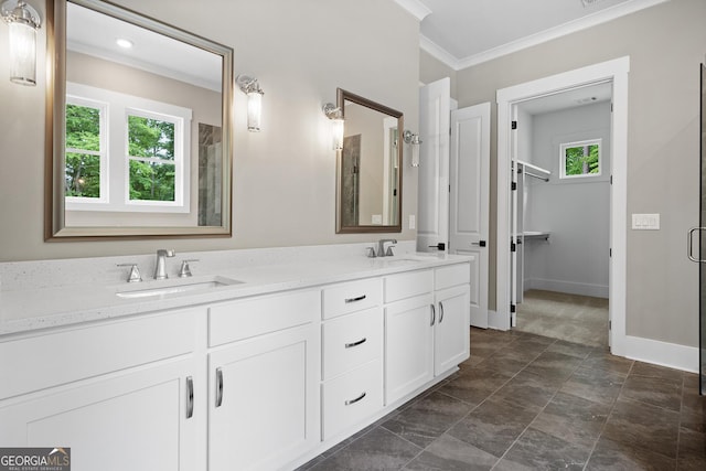 bathroom with vanity, an enclosed shower, and ornamental molding