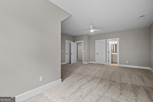 unfurnished bedroom with visible vents, baseboards, and carpet