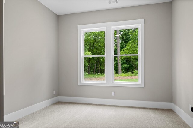 unfurnished bedroom featuring light colored carpet and ceiling fan