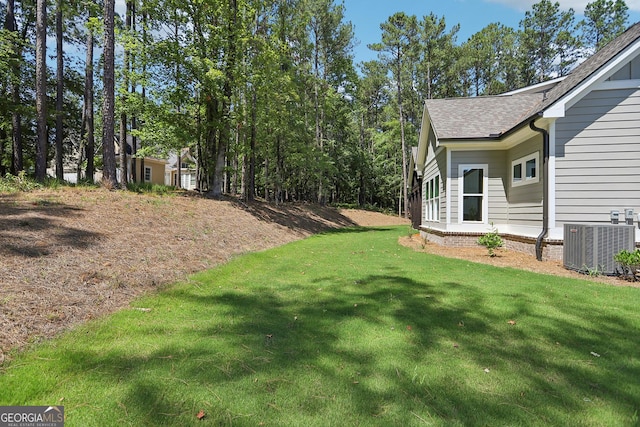 view of yard with central AC