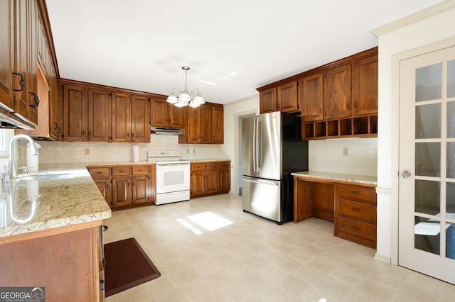 kitchen with sink, stainless steel fridge, light stone counters, decorative light fixtures, and white electric stove