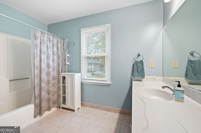 bathroom featuring tile patterned flooring, vanity, and shower / tub combo